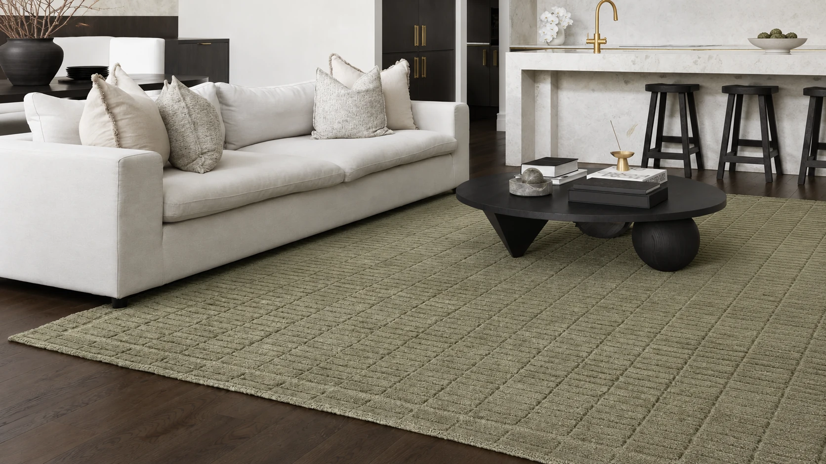 Marlow Sage wool rug displayed prominently in a contemporary living room